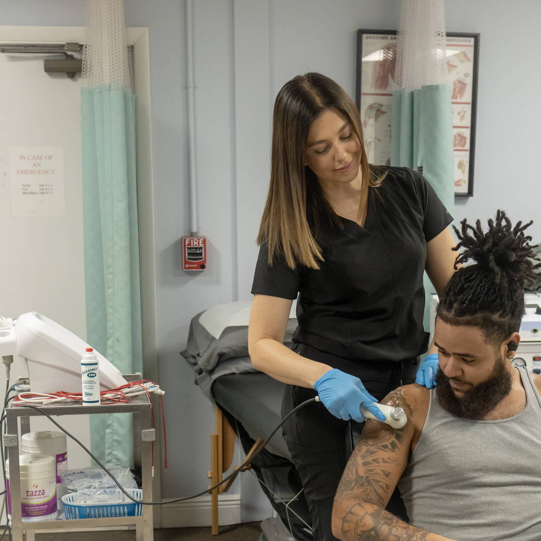 Ultrasound therapy on a patient's shoulder at Grace Medical and Chiropractic